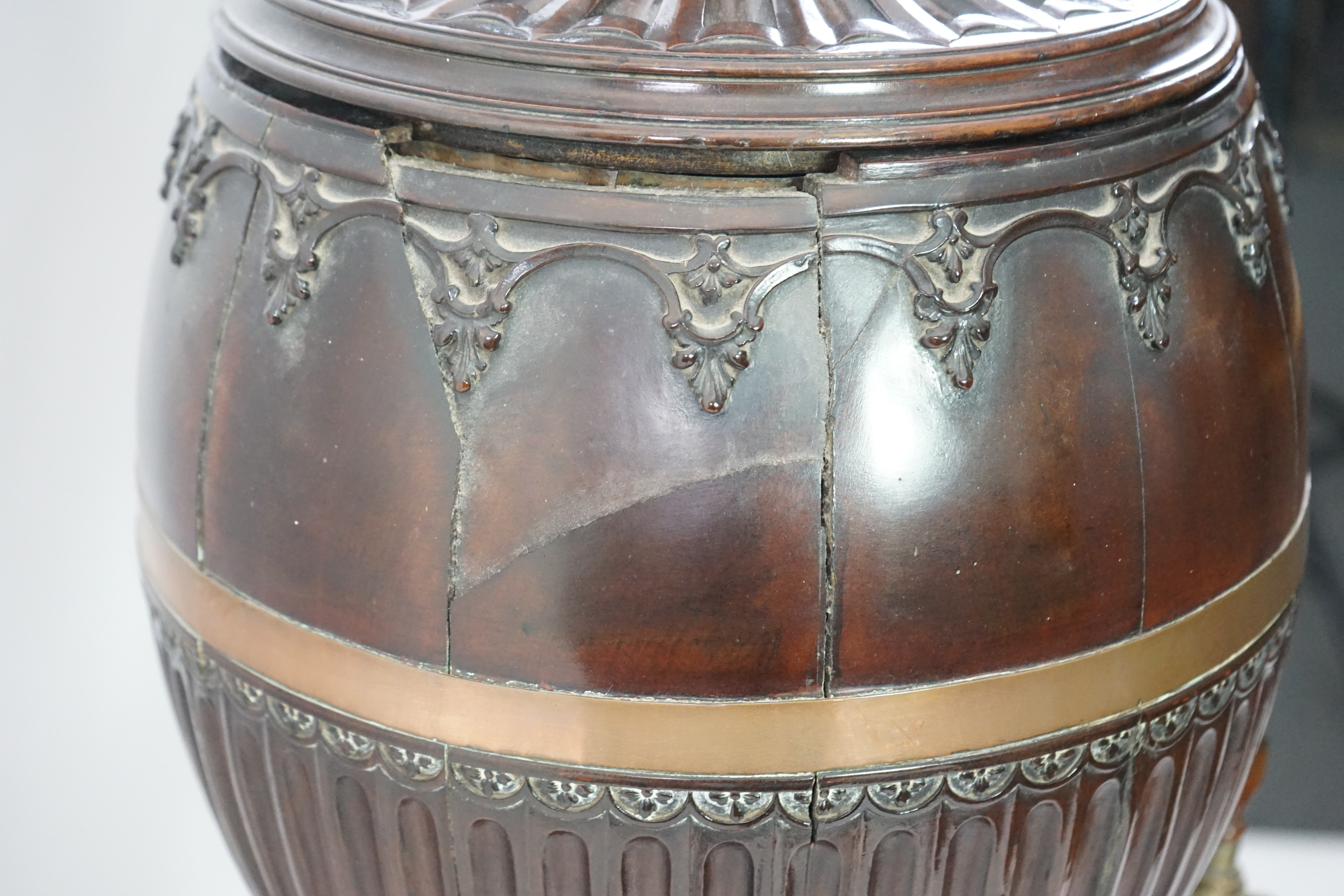 An 18th century Dutch carved mahogany wine cooler and cover